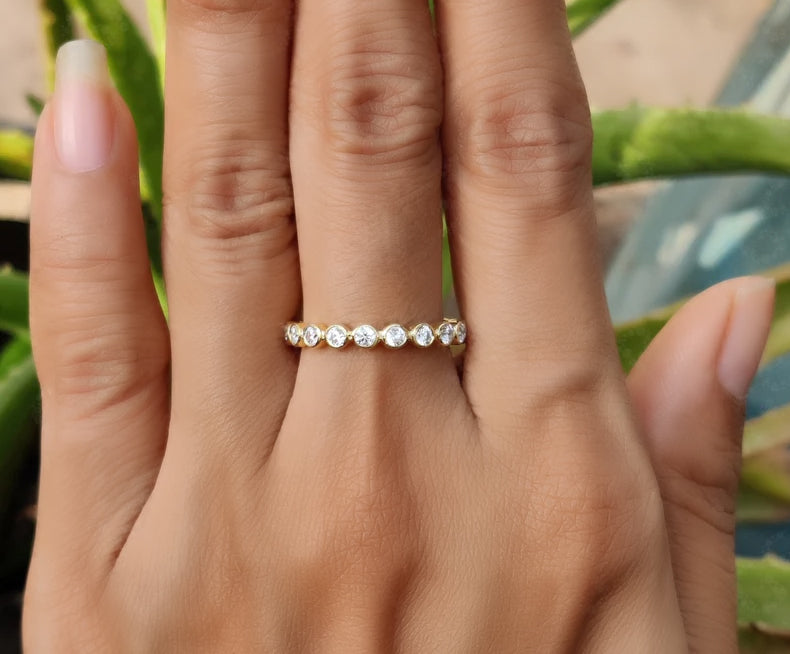 Radiate Elegance with a 2.20 mm Round Bezel Moissanite Women's Wedding Band – Available in Silver and Gold. Elevate Your Style with a Full Eternity Brilliant Cut Moissanite Ring, Ideal for Stacking
