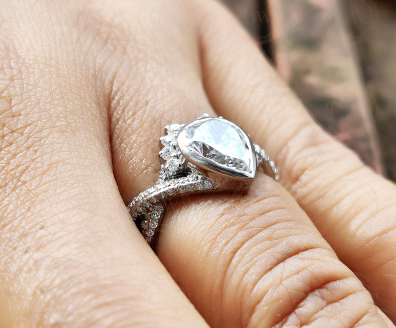 14K White Gold Pear Shaped Moissanite Engagement Ring, Bezel Set 2 Carat Pear Cut Art Deco Ring, Crossover Twisted Shank Ring For Women