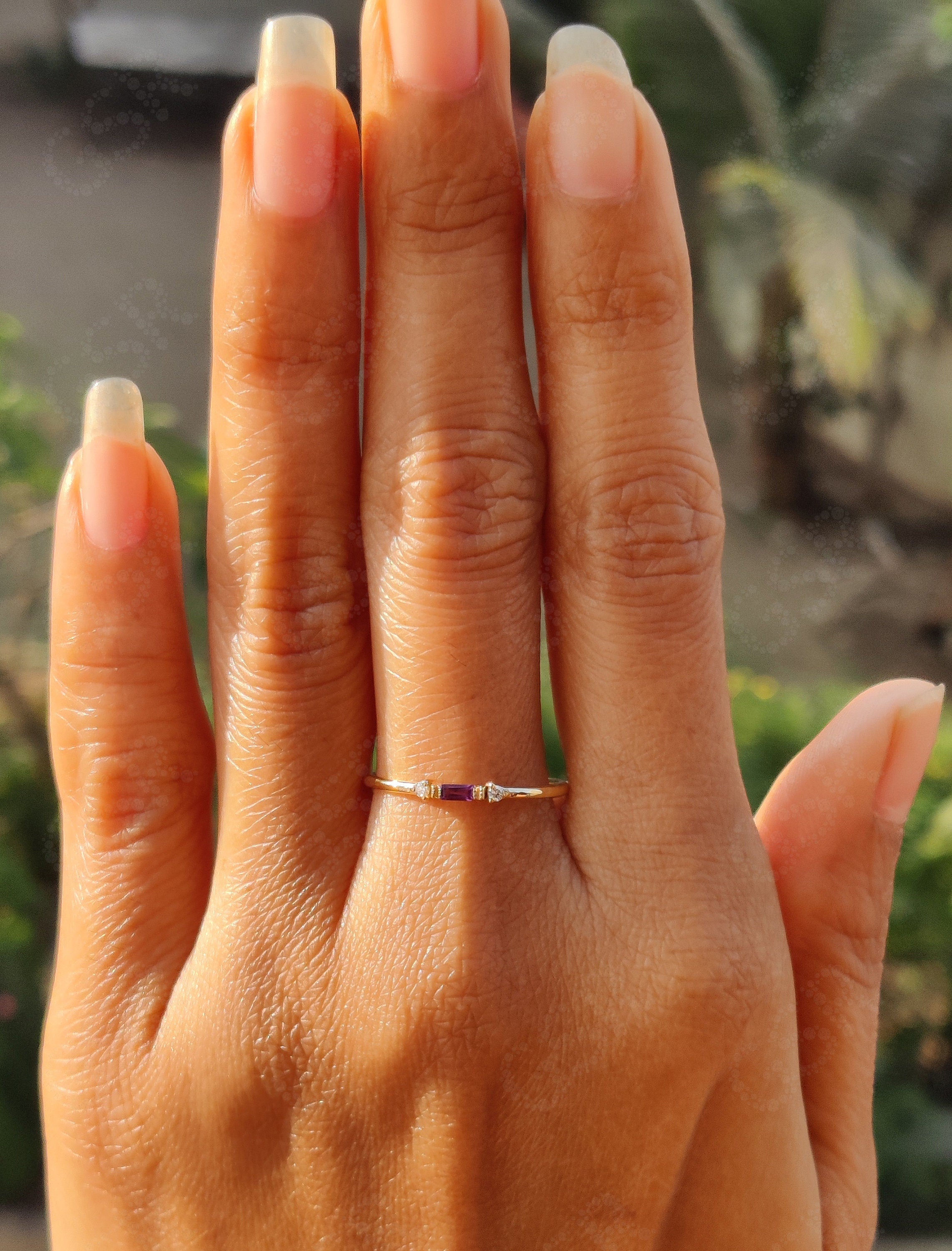 Birthstone Beauty: Stackable Silver and Gold Amethyst Rings for a Minimalist Elegance