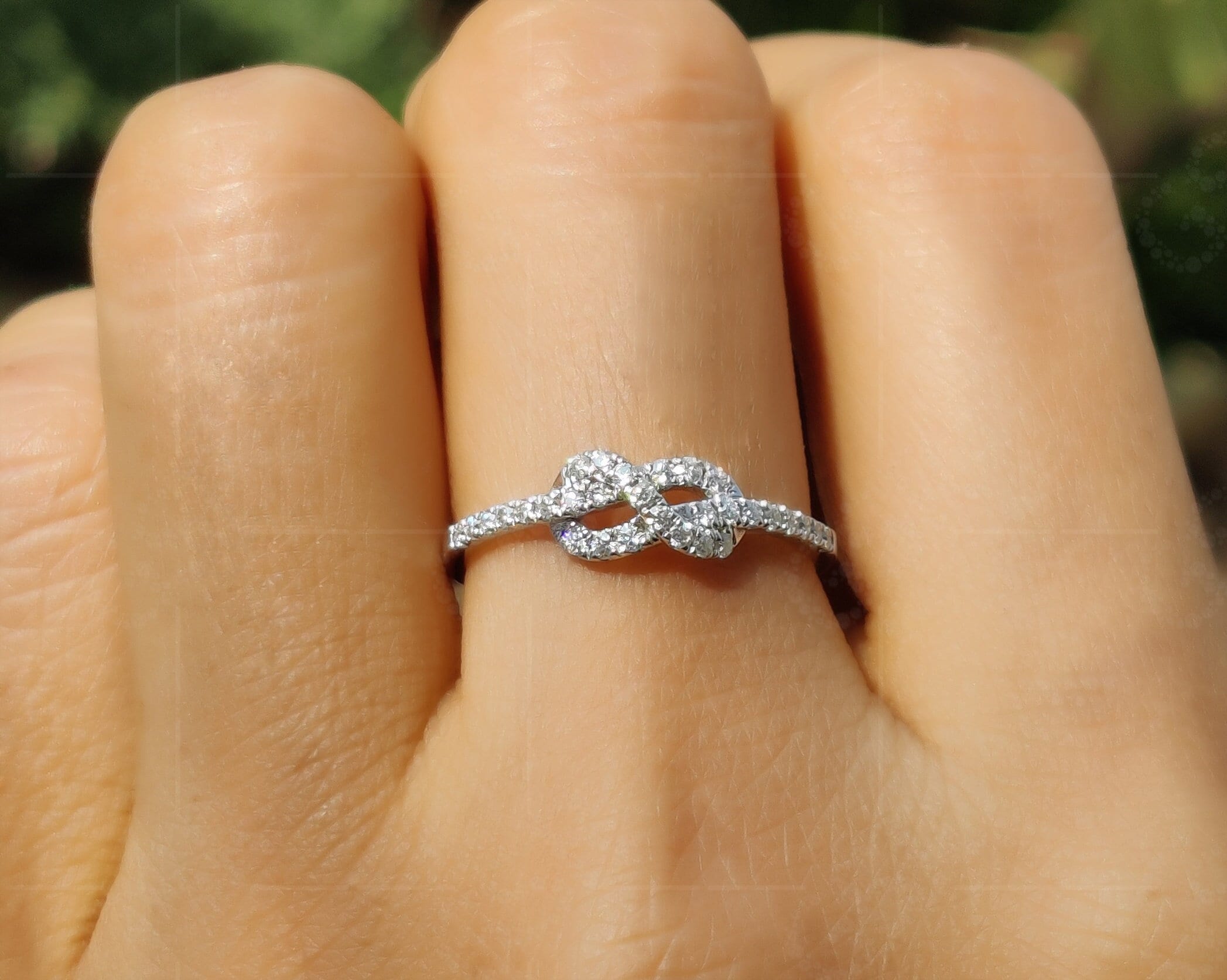 Infinite Love: Tie The Knot Stackable Ring, a Promise of Eternity and Friendship in Silver and Gold